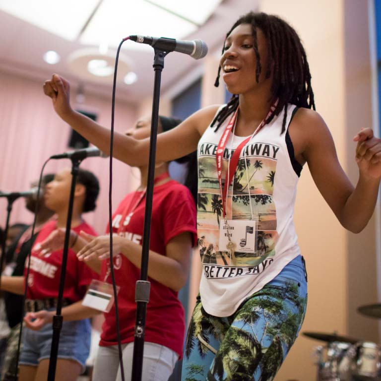 A woman sings at an event at the Neal-Marshall Black Culture Center.