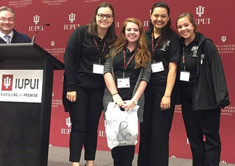 fase iupui symposium poster winners stand together