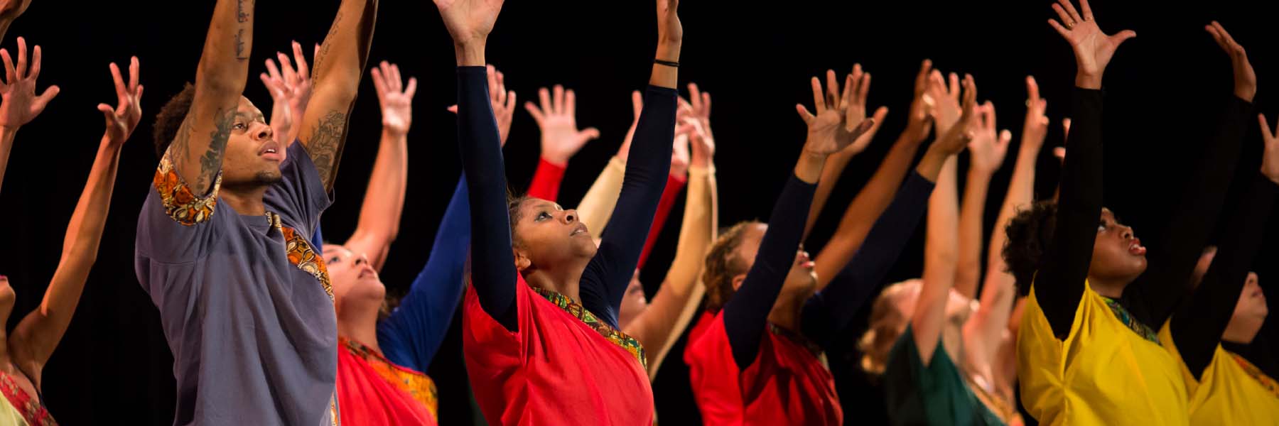 Dancers raise their arms in the air at a Neal-Marshall Black Culture Center event. 