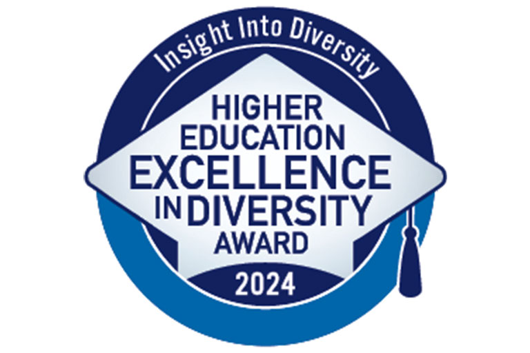 The Insight Into Diversity Higher Education Excellence in Diversity Award logo for 2024. It features a blue circle with the words 'Insight Into Diversity' at the top, and 'Higher Education Excellence in Diversity Award 2024' arranged in a diamond shape in the center, with a stylized graduation cap and tassel above.