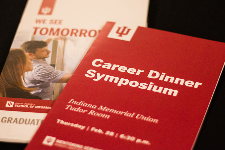 Image of Career Dinner Symposium brochure on table. 