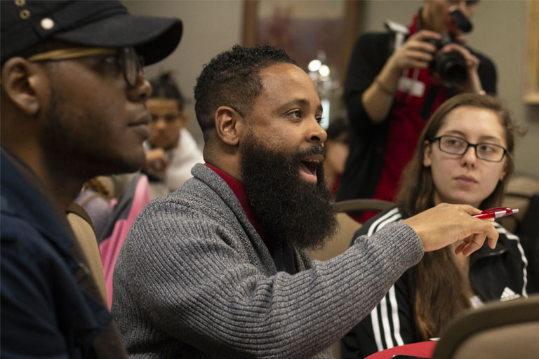 Student attendees ask questions during Keeping it Real workshop