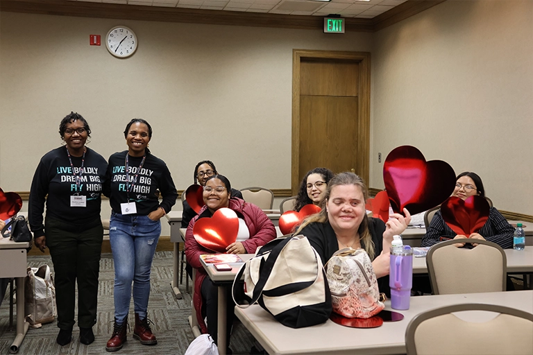 At the end of the session held by Butterfly Dreamz Board Members Tiffany Davis, esq. and Heather Lindsay, attendees wrote about their anchoring identities and beliefs on red hearts to symbolize moving with their hearts in all of their endeavors.