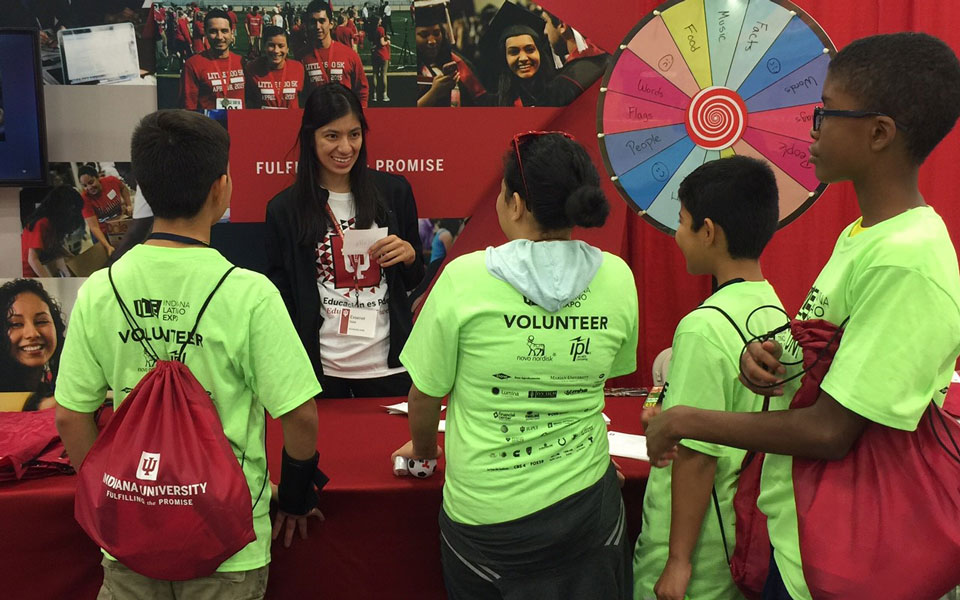 A presenter plays a game with participants during Indiana Latino Expo.