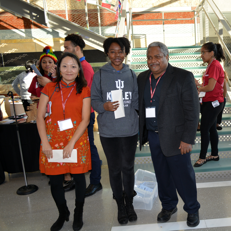 Ochmaa Escue and Martin McCrory present IU student Toni Pringley with funding. 